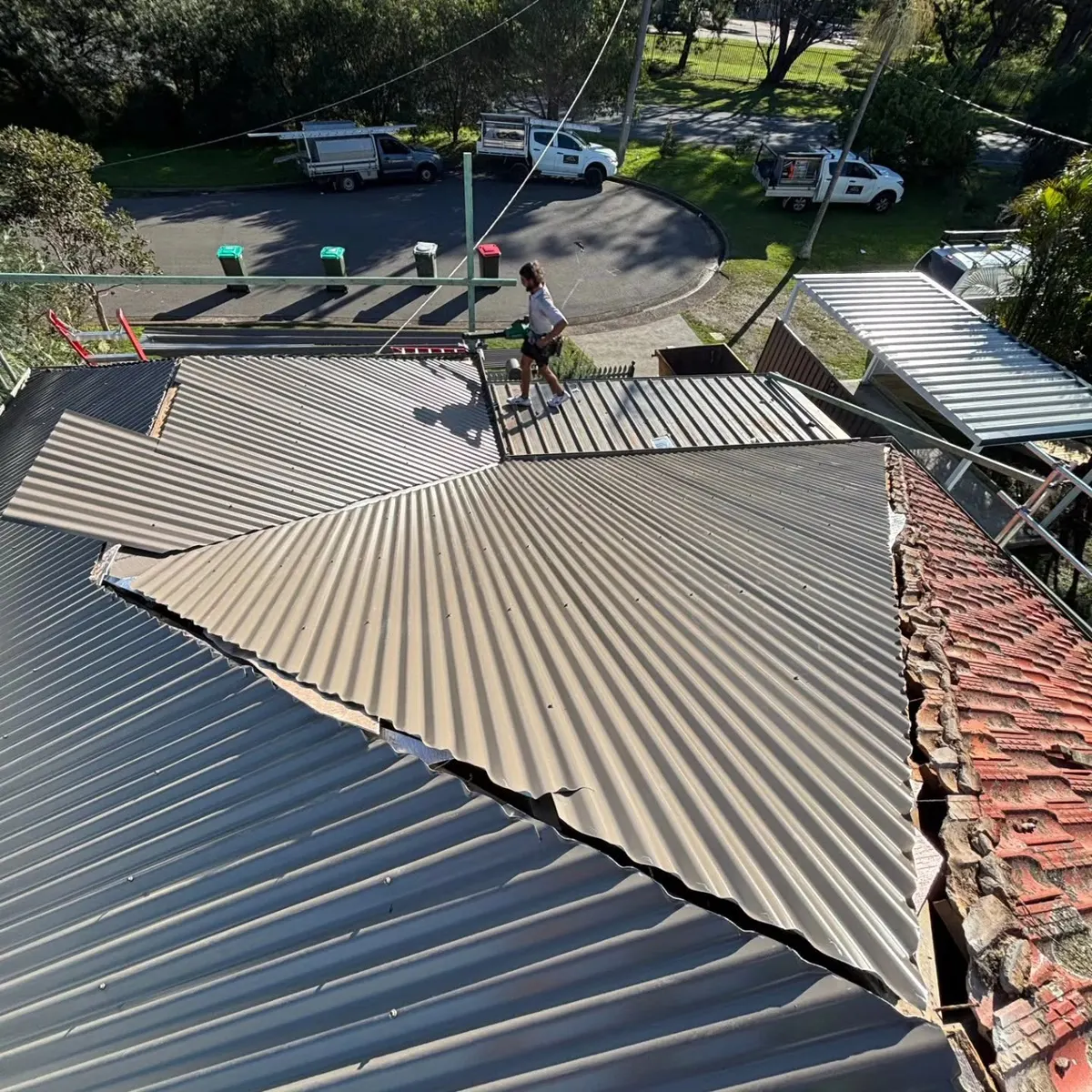 New metal sheets going on as the old tiles come off